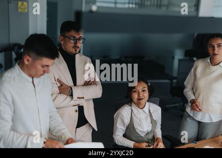 Diverse business team in office discussing project ideas collaboratively Stock Photo