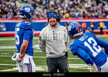 New York Giants quarterback coach Shea Tierney chats with Tommy DeVito (15) and Time Boyle (12) against the Baltimore Ravens during a NFL game at MetLife Stadium in East Rutherford, New Jersey. Duncan Williams/CSM Stock Photo