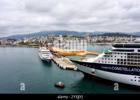 Palma de Mallorca, Spain – May 12, 2018: The Celebrity Constellation in dock with a view of Palma de Mallorca in the background. Stock Photo