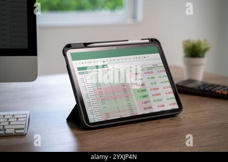 Male professional analyzing financial data and graphs in spreadsheet documents Budget Report Stock Photo