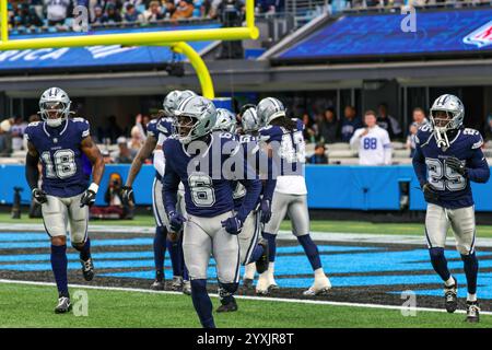 Charlotte, North Carolina, USA. 15th Dec, 2024. Dallas Cowboys linebacker DAMONE CLARK (18), Dallas Cowboys safety DONOVAN WILSON (6) and Dallas Cowboys cornerback ANDREW BOOTH JR. (25) run back to the bench after celebrating in the end zone following an interception during the first half of the regular season NFL game between the Dallas Cowboys and the Carolina Panthers at Bank of America Stadium in Charlotte, NC on 15 Dec 2024. The Cowboys defeated the Panthers 30''”14. (Credit Image: © Israel Anta via ZUMA Press Wire) EDITORIAL USAGE ONLY! Not for Commercial USAGE! Stock Photo