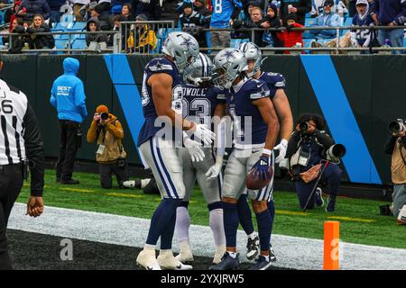 Charlotte, North Carolina, USA. 15th Dec, 2024. Dallas Cowboys running back RICO DOWDLE (23), Dallas Cowboys wide receiver CEEDEE LAMB (88), Dallas Cowboys tight end LUKE SCHOONMAKER (86) celebrate in the end zone with Dallas Cowboys wide receiver JALEN TOLBERT (1) after he scores during the second half of the regular season NFL game between the Dallas Cowboys and the Carolina Panthers at Bank of America Stadium in Charlotte, NC on 15 Dec 2024. The Cowboys defeated the Panthers 30''”14. (Credit Image: © Israel Anta via ZUMA Press Wire) EDITORIAL USAGE ONLY! Not for Commercial USAGE! Stock Photo