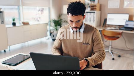 Doctor, man or typing on laptop in hospital for checking patient information, medical records or treatment research. Healthcare, admin and technology Stock Photo