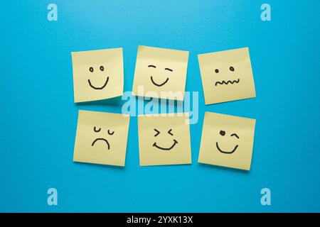 Adhesive notes or Sticky notes with different sad and happy emotions Stock Photo