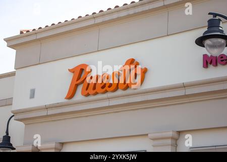 Irvine, California, United States - 03-29-2019: A view of a store front sign for the restaurant called Puesto. Stock Photo