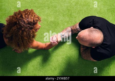sportswoman during arm wrestling with bodybuilder Stock Photo