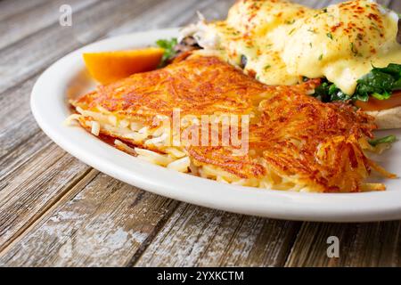 A view of a side portion of shredded hash browns, part of a breakfast entree. Stock Photo