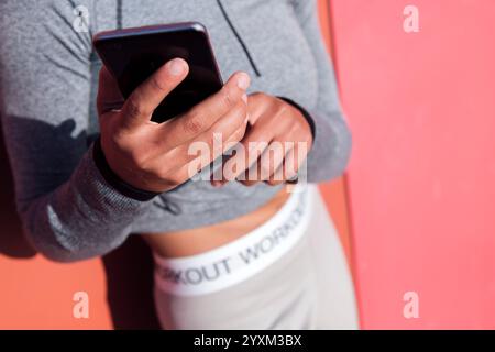 close up of an anonymous woman using cellphone Stock Photo