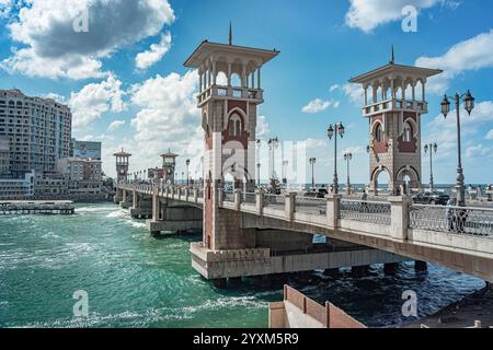 Stanley Bridge in Alexandria, Egypt, showcases its elegant towers and arches over the Mediterranean Sea. Iconic architecture with coastal waters. Stock Photo