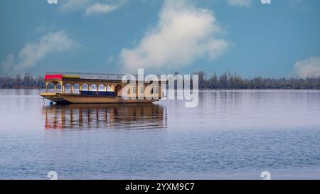 Beautiful houseboat .Kashmir's houseboats, floating palaces on the serene Dal Lake, offer a unique blend of luxury and tradition. Stock Photo