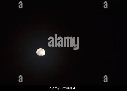 half moon floating on sky in night Stock Photo