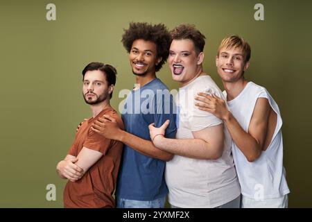 Four individuals express joy and pride, showcasing their unique styles and camaraderie together. Stock Photo