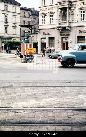 Traffic policeman in street in front of hotels, Bergheimer Strasse, Heidelberg, Baden-Württemberg, Germany, Europe, 1959 Stock Photo