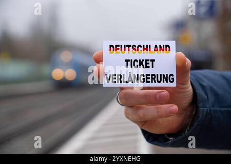 Bavaria, Germany - 17 December 2024: Symbolic image for the continuation of the Deutschlandticket in 2025. Despite the planned price increase to 58 euros, the ticket remains a central pillar of the mobility transition in Germany and continues to enable nationwide use of local public transport. PHOTOMONTAGE *** Symbolbild für die Fortführung des Deutschlandtickets im Jahr 2025. Trotz der geplanten Preiserhöhung auf 58 Euro bleibt das Ticket eine zentrale Säule der Mobilitätswende in Deutschland und ermöglicht weiterhin eine flächendeckende Nutzung des öffentlichen Nahverkehrs. FOTOMONTAGE Stock Photo