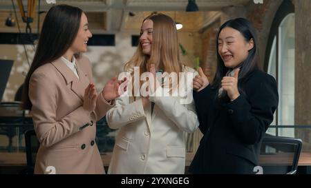 Happy smiling laughing joyful positive friendly business women people colleagues females multiracial multiethnic girls businesswomen diversity Stock Photo