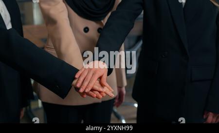 Multiracial women business colleagues three multiethnic businesswomen girls Caucasian Asian Muslim ladies ethnic different unite happy office team Stock Photo