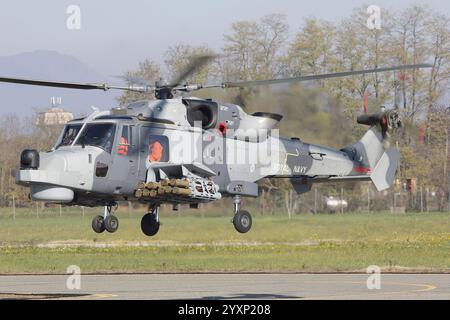 A Royal Navy AW159 Wildcat helicopter equipped with simulated Martlet missiles. Stock Photo
