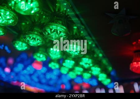 A colorful light display with green, red, and blue lights. The lights are arranged in a way that creates a festive and lively atmosphere Stock Photo