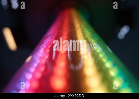 A rainbow is shown in a blurry image, with the colors of the rainbow being red, orange, yellow, green, blue, indigo, and violet. The image has a dream Stock Photo