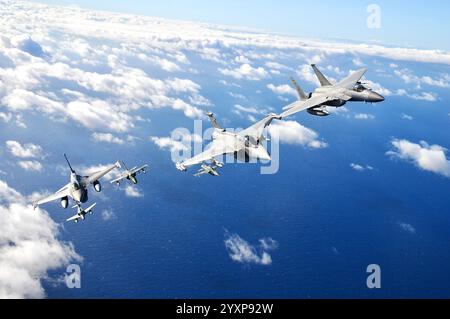 Formation of military jet fighters flying in formation. Stock Photo