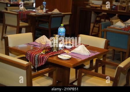 A beautifully set table in a luxurious 5-star hotel buffet in Muscat, Oman, ready for Iftar. Stock Photo