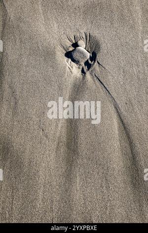 WA25954-00...WASHINGTON - Pebbles in the sand at Second Beach on the Pacific Coast in Olympic National Park. Stock Photo