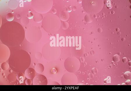 Abstract pink oil bubbles with soft focus, smooth texture, light reflections, and circular patterns. Ideal for backgrounds, designs, or creative proje Stock Photo
