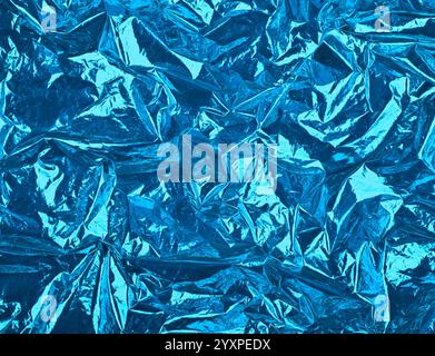 Close up festive abstract background of blue crumpled glossy metallic plastic foil Stock Photo