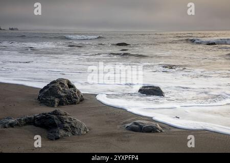 WA28004-00...WASHINGTON - Beach, rocks near sunset at Third Beach, Olympic National Park. Stock Photo