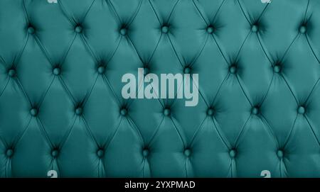Close up background texture of turquoise teal blue capitone genuine leather, retro Chesterfield style soft tufted furniture upholstery with deep diamo Stock Photo
