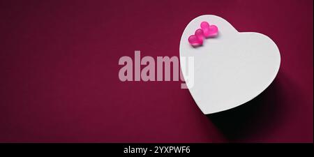 White paper hearts isolated on red background, valentines day, copy space for text. Stock Photo