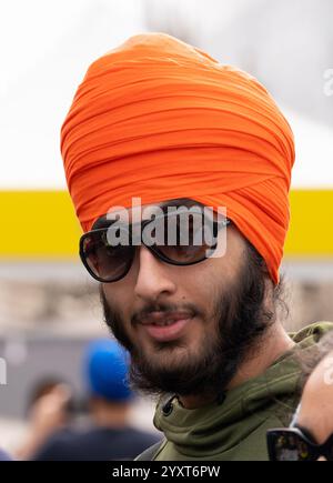 Young Sikh man with turban attending the Vaisakhi Festival in Trafalgar Square, the event celebrating Sikh culture and the annual spring harvest. Stock Photo