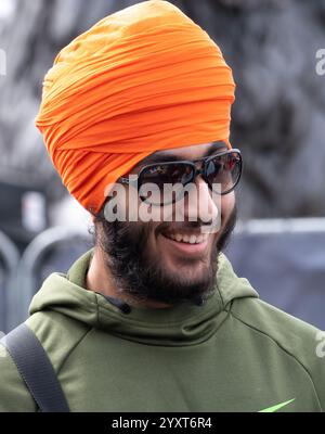 Young Sikh man with turban attending the Vaisakhi Festival in Trafalgar Square, the event celebrating Sikh culture and the annual spring harvest. Stock Photo