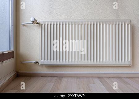 wall mounted radiator in private household Stock Photo