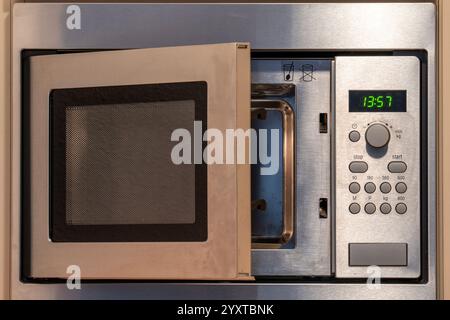 microwave oven in fitted kitchen Stock Photo