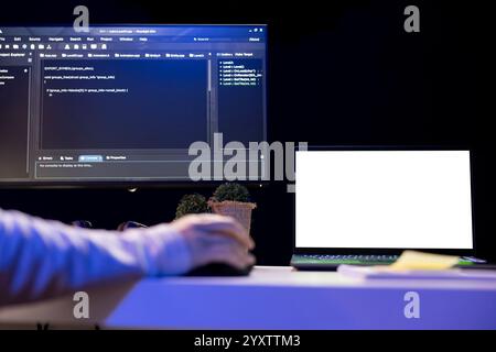 Computer scientist designing and developing software applications using isolated screen laptop. IT expert implementing and maintaining company systems using mockup notebook Stock Photo