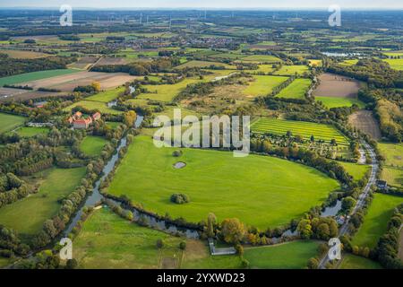 Aerial view, Oberwerries Castle surrounded by green meadows and fields, river Lippe meanders and Lippe floodplain, distant view with wind turbines, Ue Stock Photo