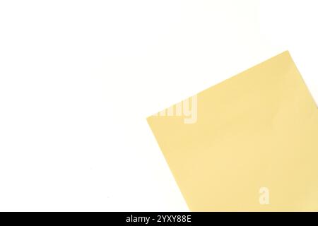 Top view of yellow sticky note paper on white background Stock Photo