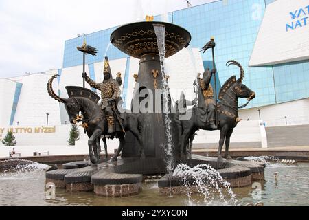 Statue of man in golden suit located in front of the National Museum. Astana, Kazakhstan. Stock Photo