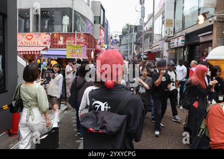 Young man with red coloured hair in Takeshita Street  in Tokyo, Shibuya, Japan, Asia. Stock Photo