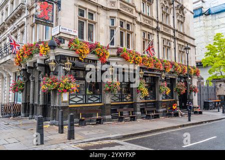 London, England - September 8.2024: Street view of the Red Lion pub with flowers at the Westminster Stock Photo