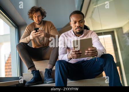 Programmers cooperating at IT company developing apps. People business work office concept Stock Photo