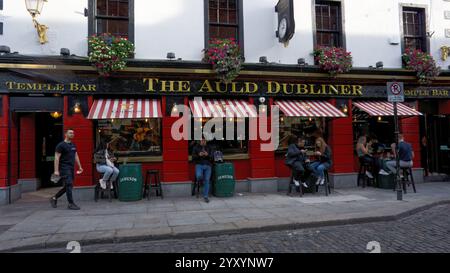 Dublin, Ireland - June 14, 2024: View of exterior of The Auld Dubliner public house in Anglesea Street Temple Bar showing customers seated outside usi Stock Photo