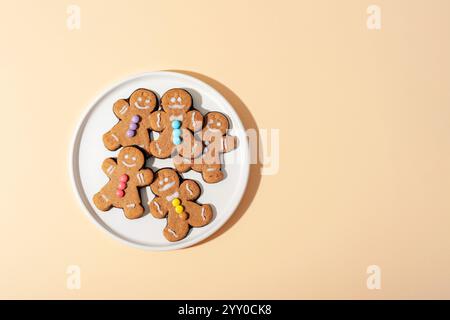 Gingerbread cookies on a white plate. Top view with copy space. Stock Photo
