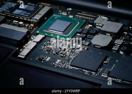 Close-up part of motherboard from laptop computer show up a CPU and other components on board Stock Photo