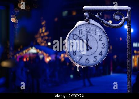 Vintage street clock in winter. New Year time.. Stock Photo