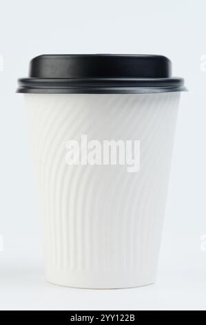 White paper cup with black lid front view isolated on studio background Stock Photo
