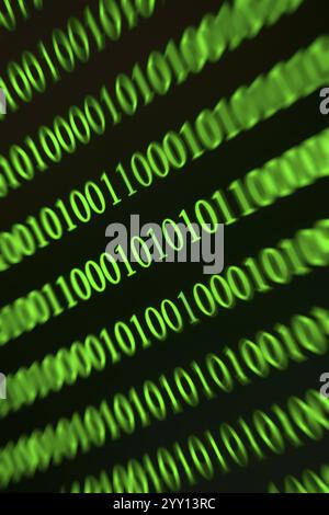 Digital green binary numbers with blurring, symbolises data stream effect Stock Photo