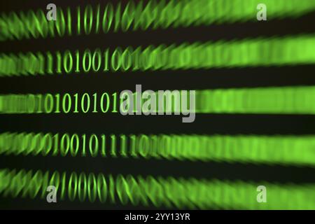 A blurred green binary code as a sign of movement and speed Stock Photo