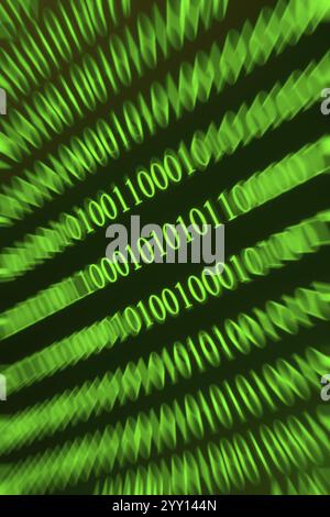 Swirling green binary numbers with blurring, techno-like representation Stock Photo